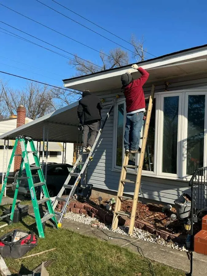 Restoration crew performing exterior repair in Ionia